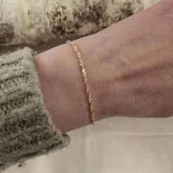 Guldarmband vriden singapore